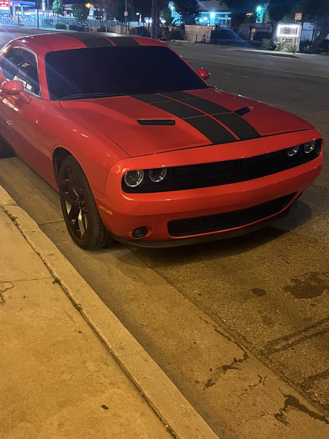 Orange Dodge Challenger with black stripes