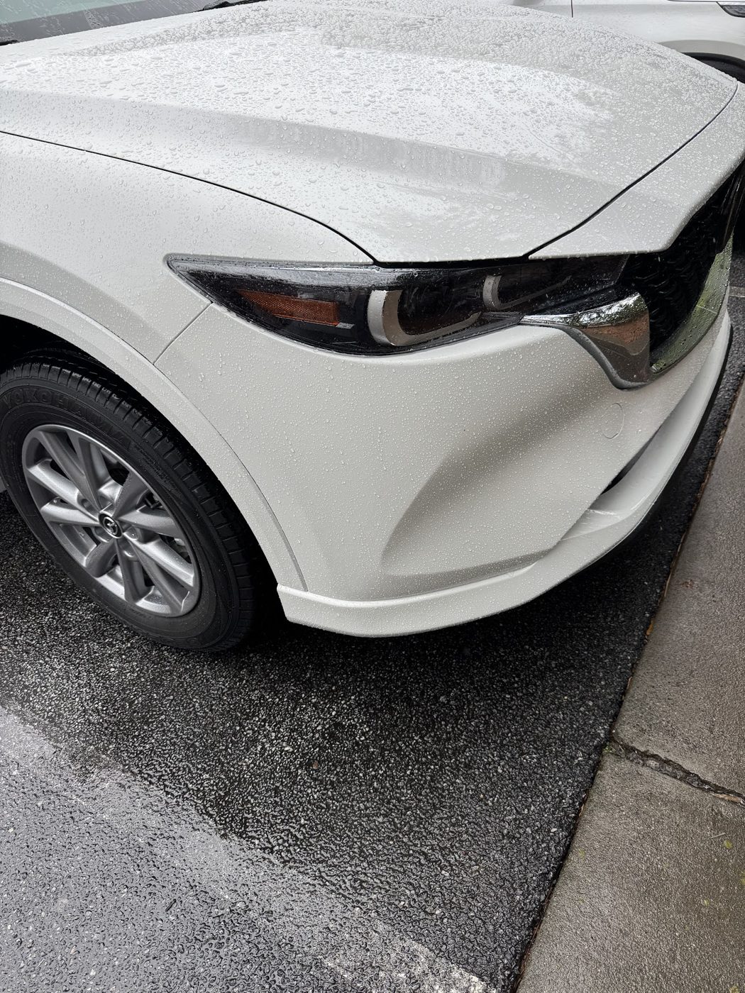 White Mazda front bumper repair