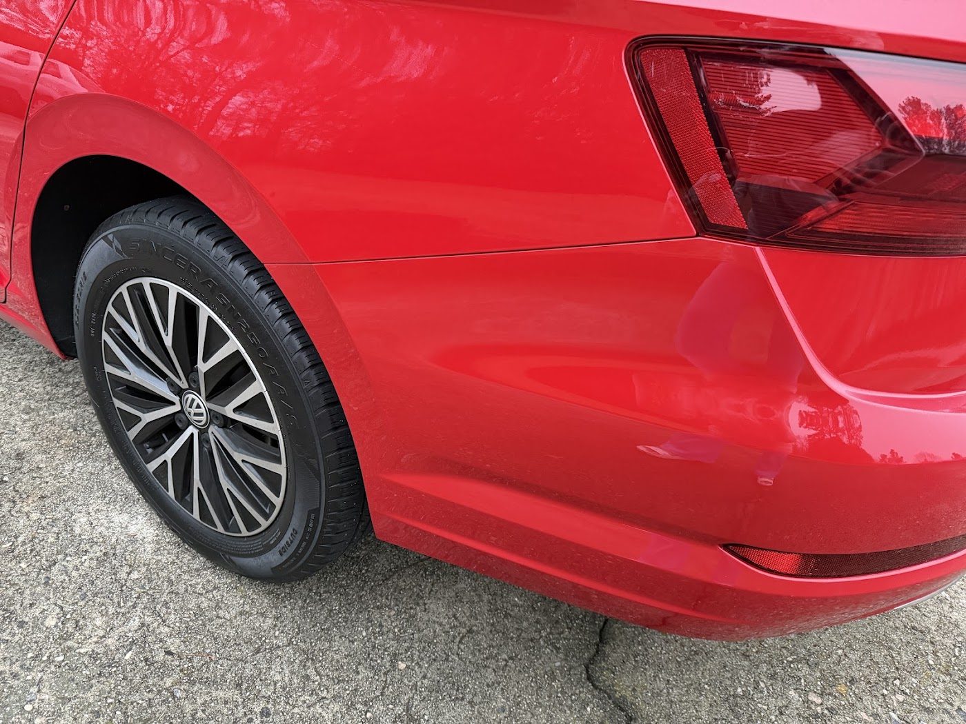 Red car rear quarter panel